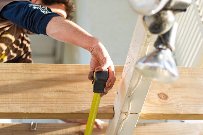 Deck builder measuring lumber Fort Wayne